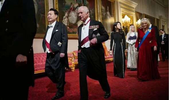 King Charles walks with President Yoon Suk Yeol